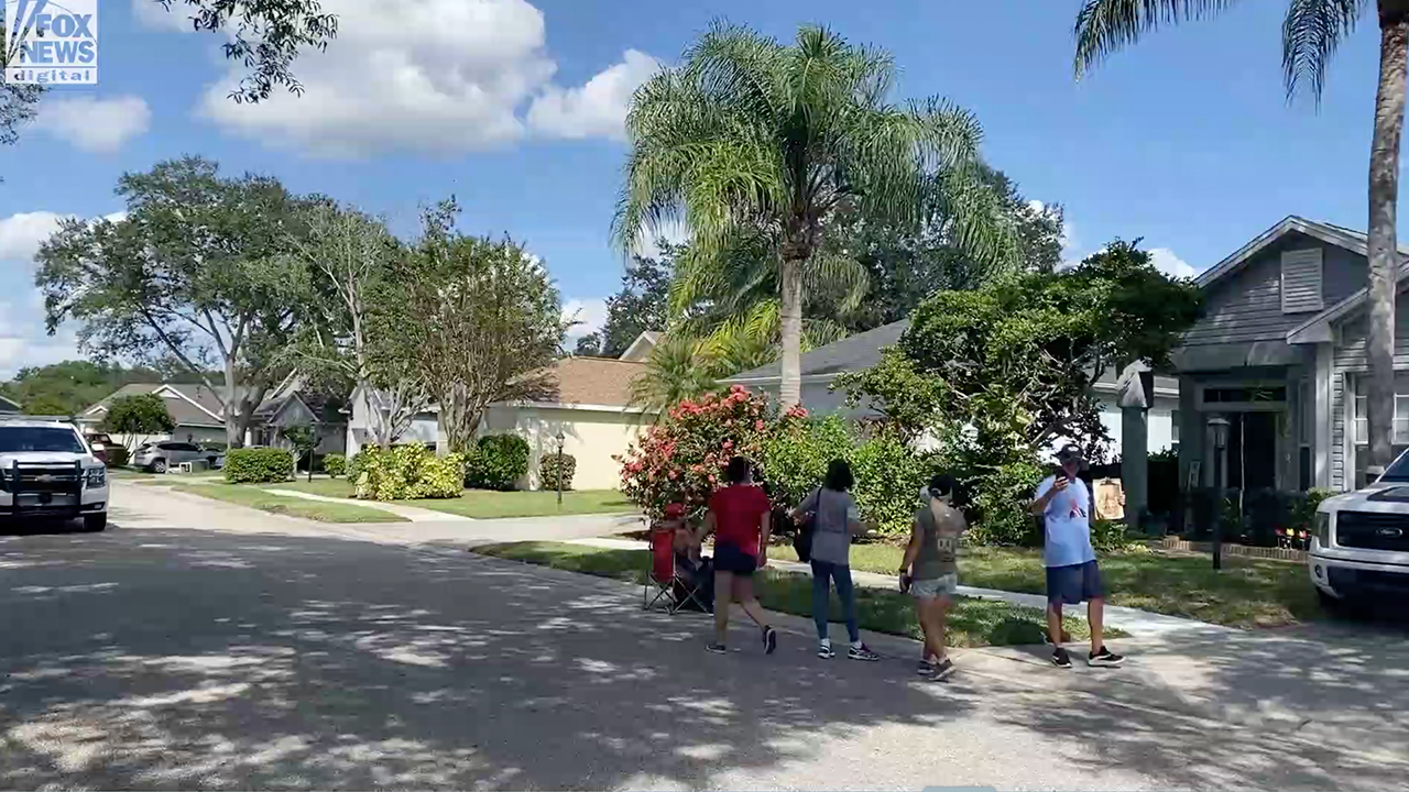 Protesters gather in front of Cassie Laundrie's house