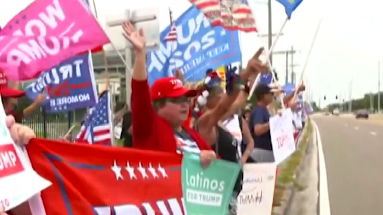 Lawrence Jones talks to Trump supporters outside Joe Biden event in Florida