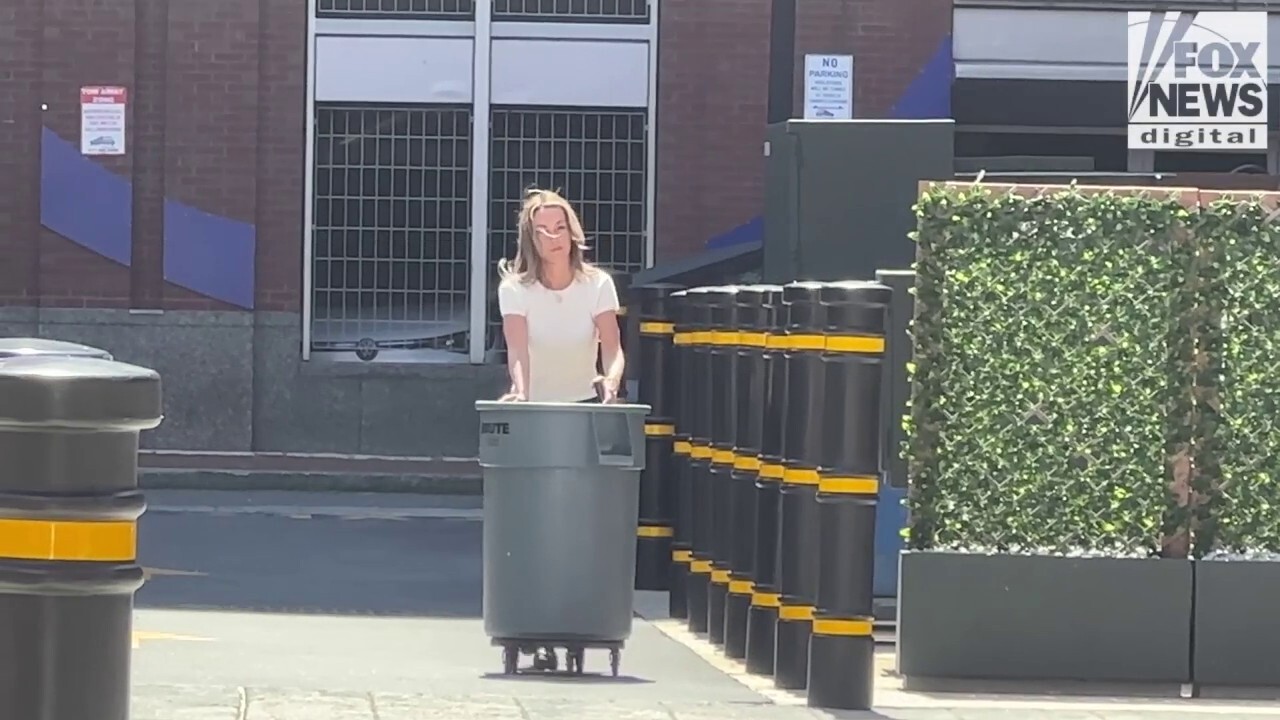 Karen Read takes out the trash behind Boston hotel