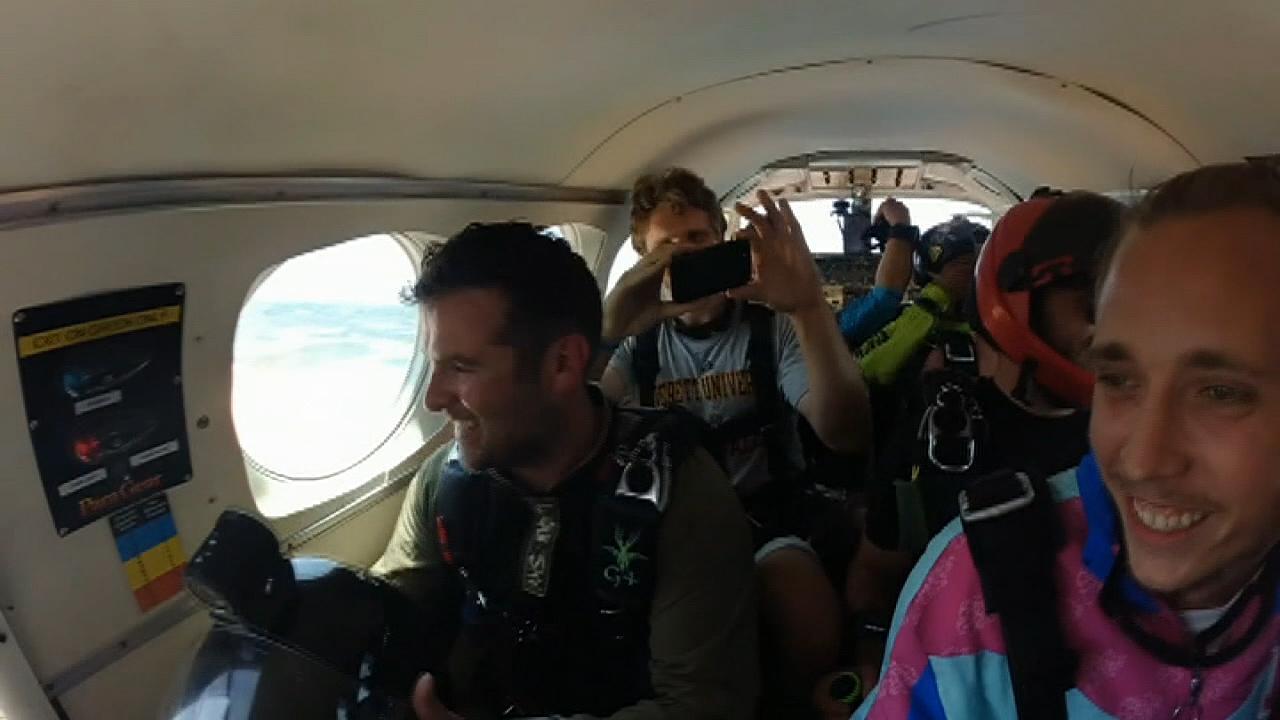 Family stages skydiving gender reveal