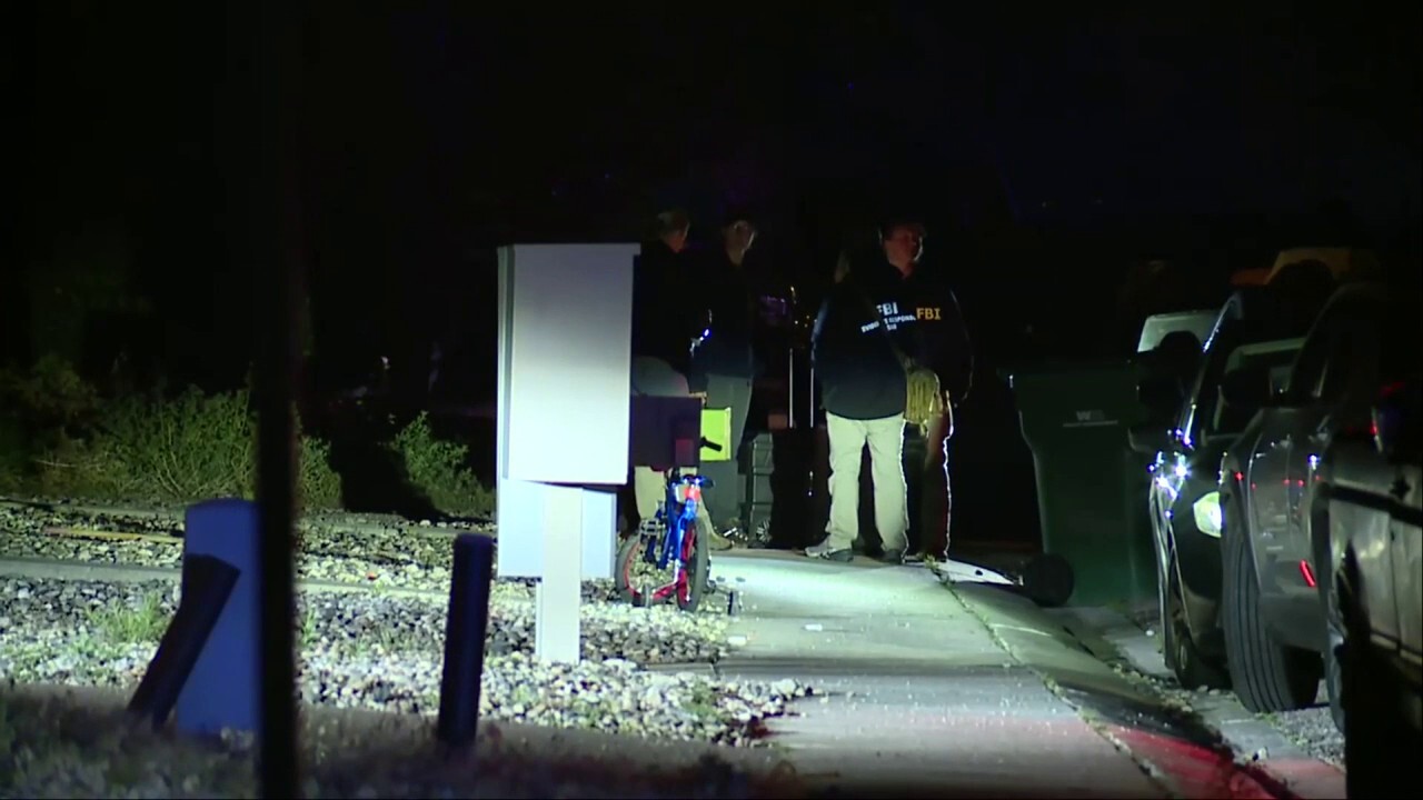 FBI appear outside suspected Colorado attacker's home