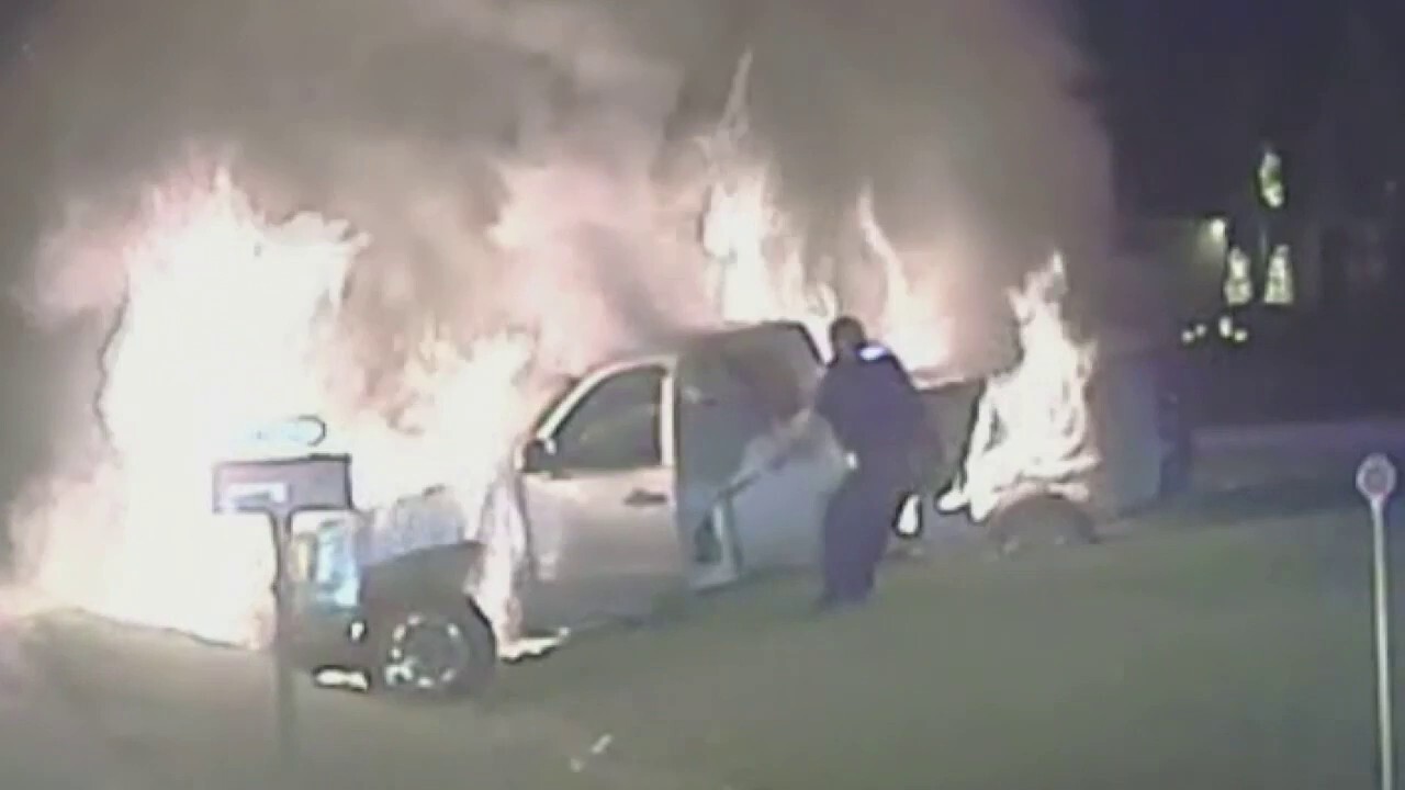 Michigan police officer pulls woman from burning vehicle