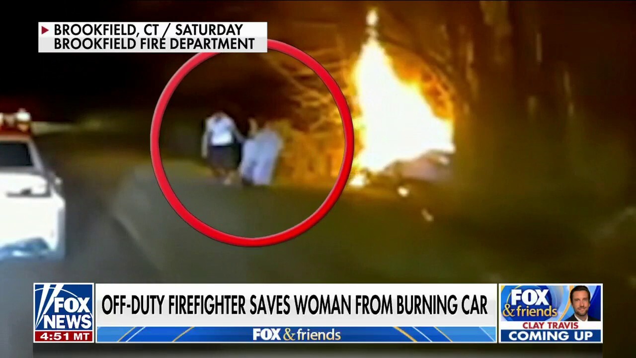 Hero off-duty firefighter rescues woman from burning car