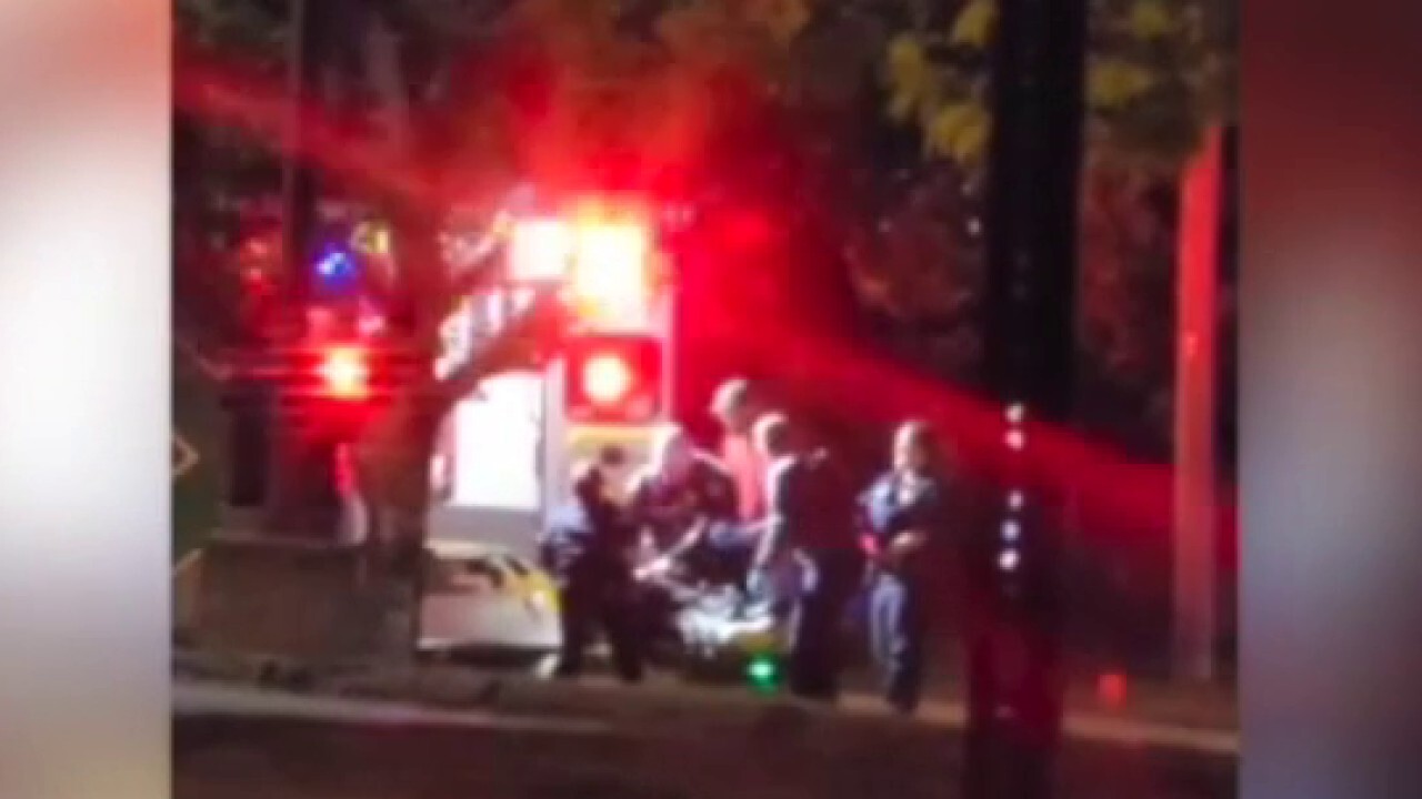  First responders load individual into ambulance after shooting in Lewiston, Maine