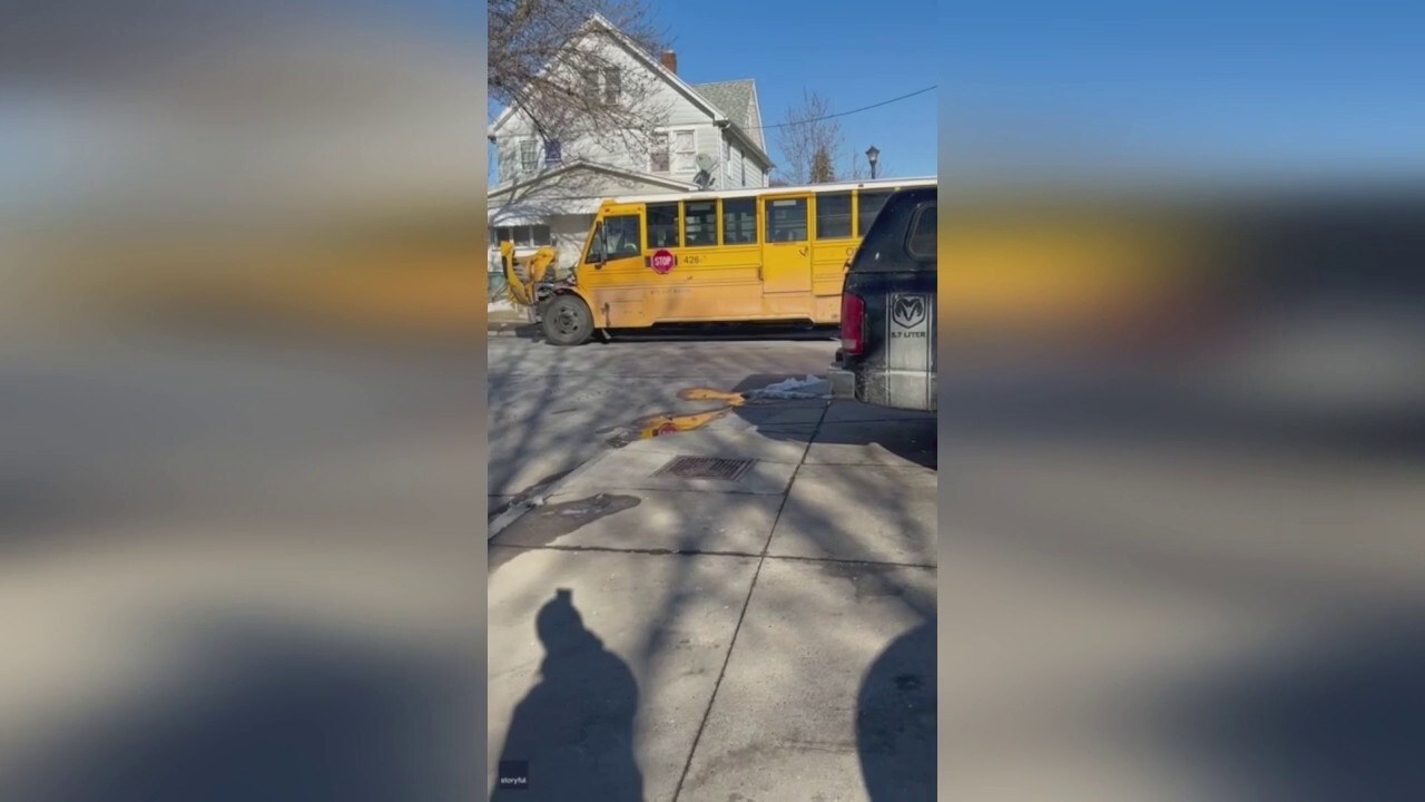 New York carjacking suspects crash into school bus full of children during police chase.mp4