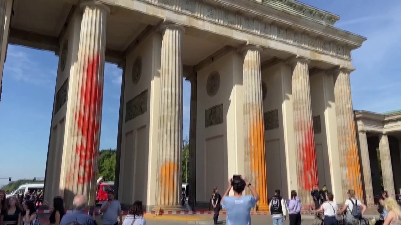 German climate activists spray paint Brandenburg Gate in Berlin