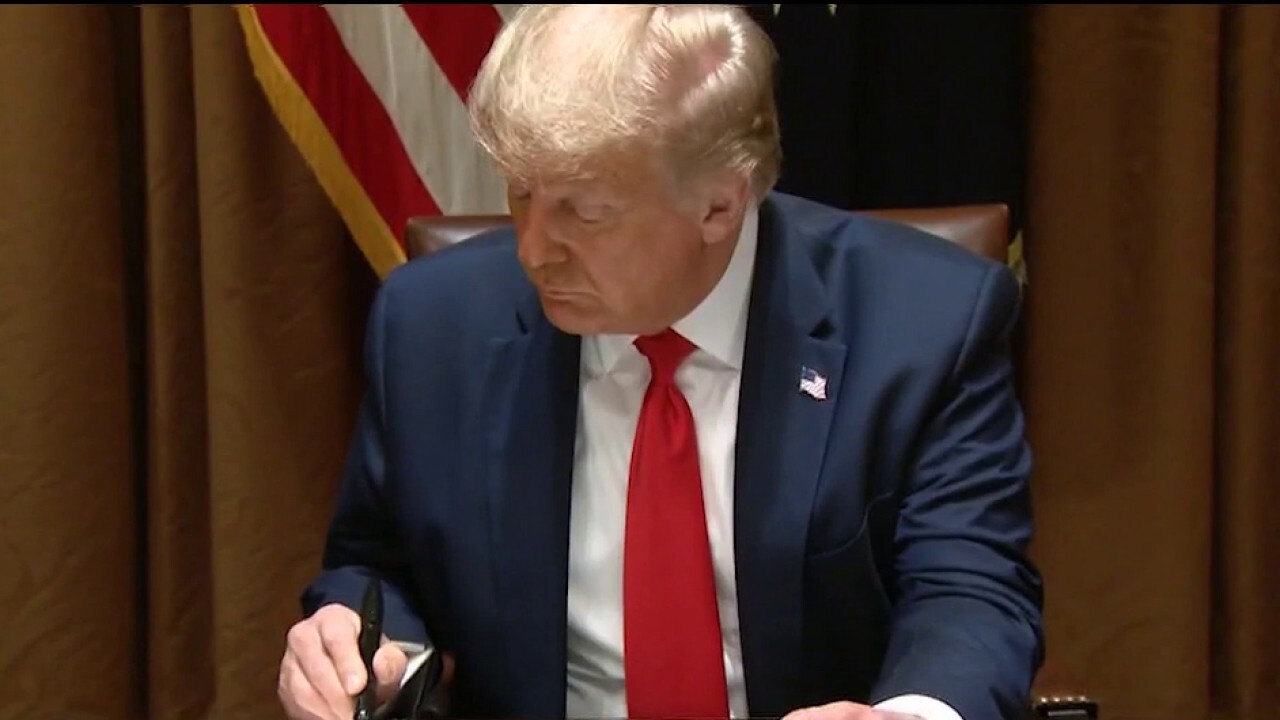 Trump signs order protecting American workers	