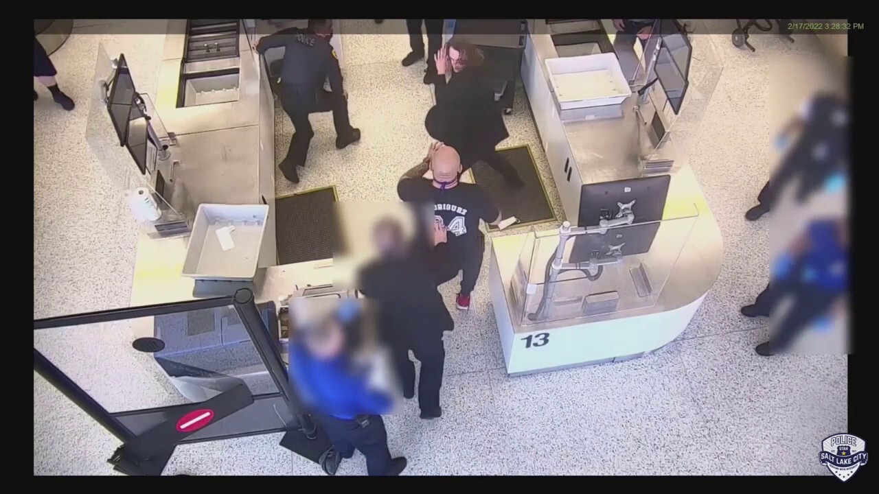 Salt Lake City police officer assaulted at airport, bystander jumps in to help subdue suspect, video shows