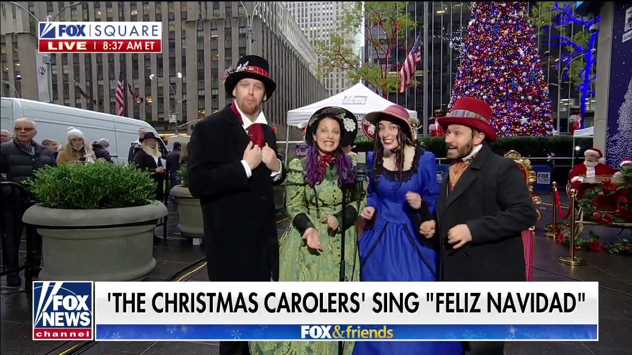 The Christmas Carolers perform 'Feliz Navidad' on Fox Square