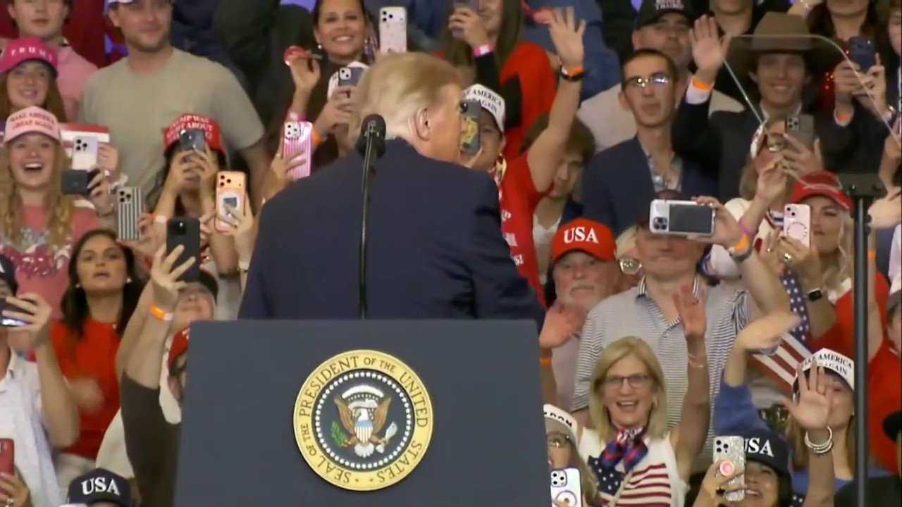 Trump tosses hats into cheering crowd before taking stage at Texas rally