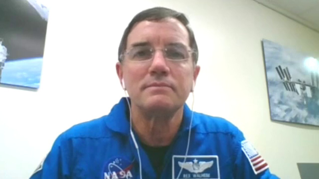SpaceX launch scrubbed due to weather; NASA astronaut Rex Walhein weighs in.