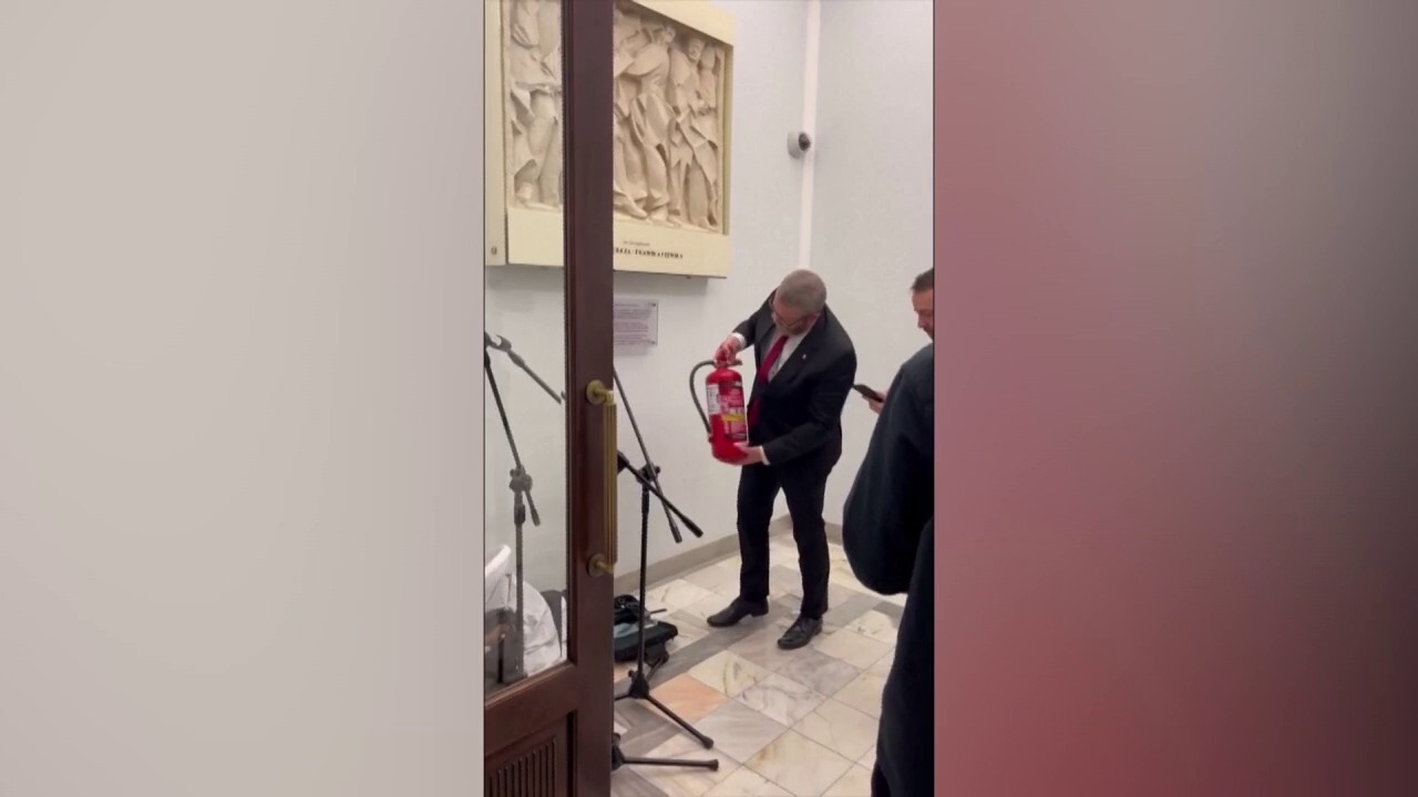 Far-right Polish lawmaker stokes outrage after blasting menorah with fire extinguisher