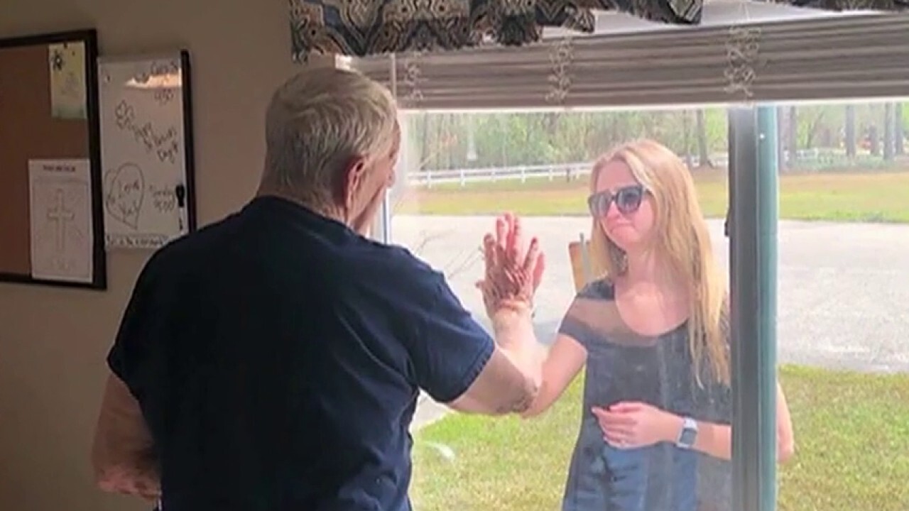 North Carolina woman surprised quarantined grandfather with engagement through window