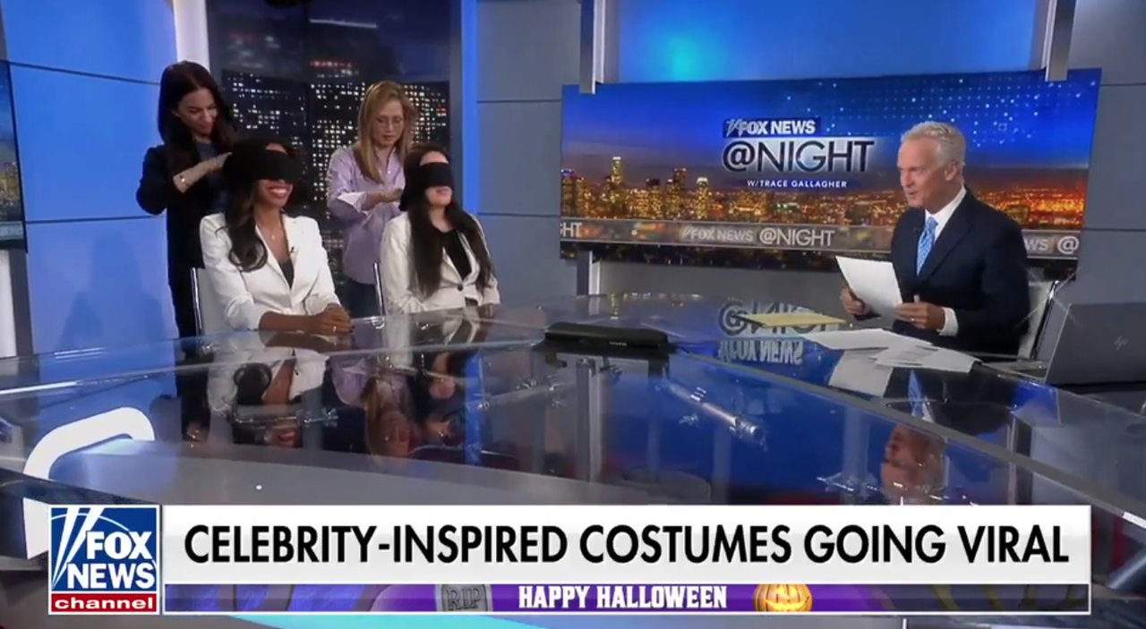 Blindfolded guests play Halloween costume guessing game