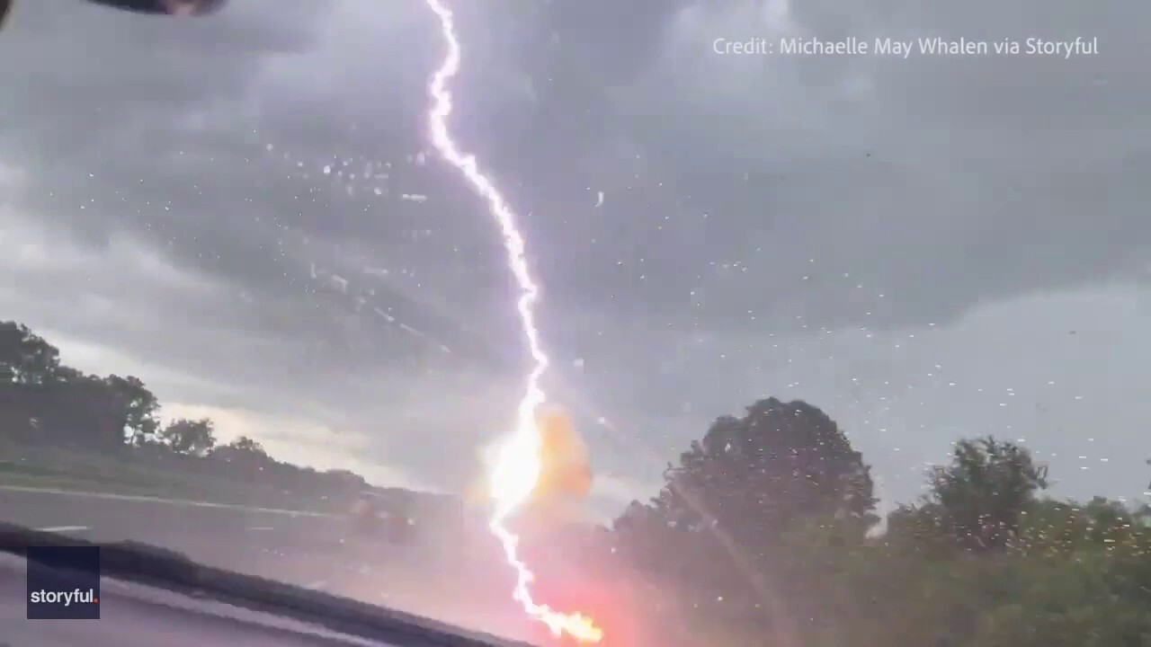 Woman in Florida films moment lightning strikes vehicle in front of her