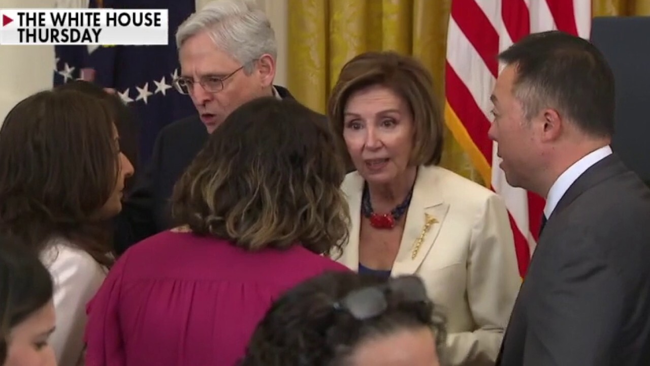 Video shows Pelosi maskless hugging people at crowded event