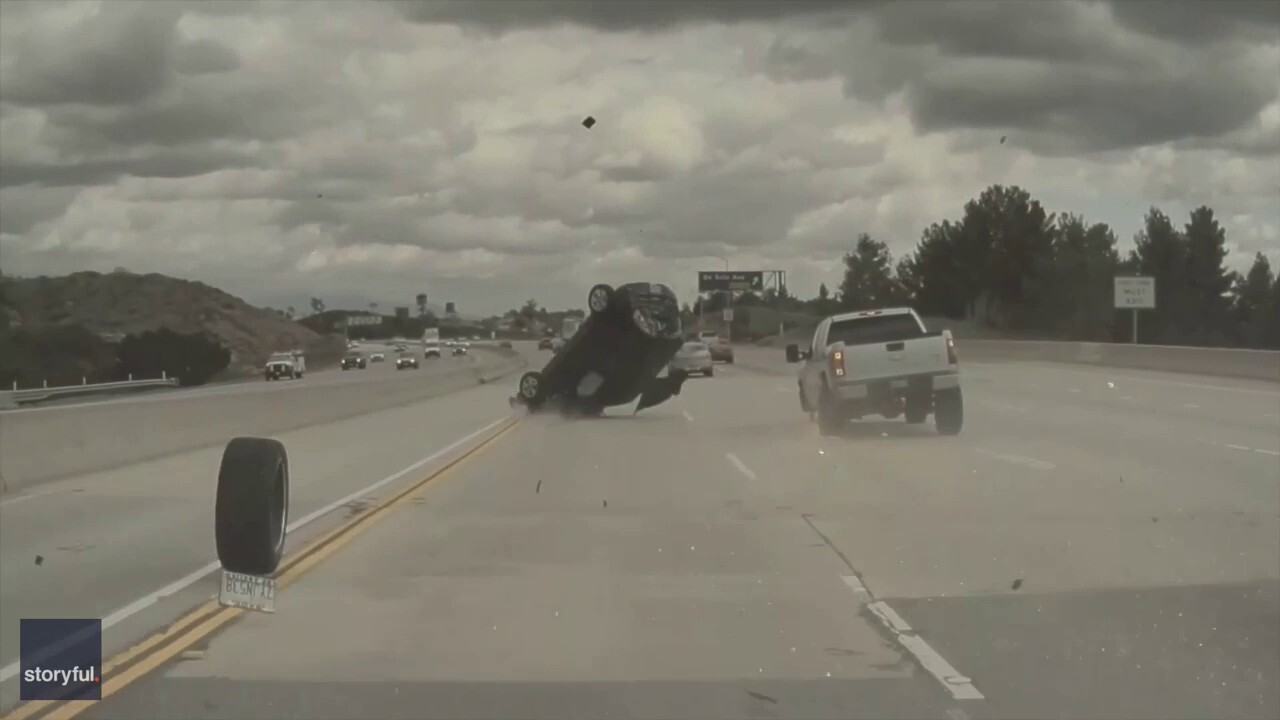Car flips on Los Angeles freeway after tire pops off pickup truck, video shows