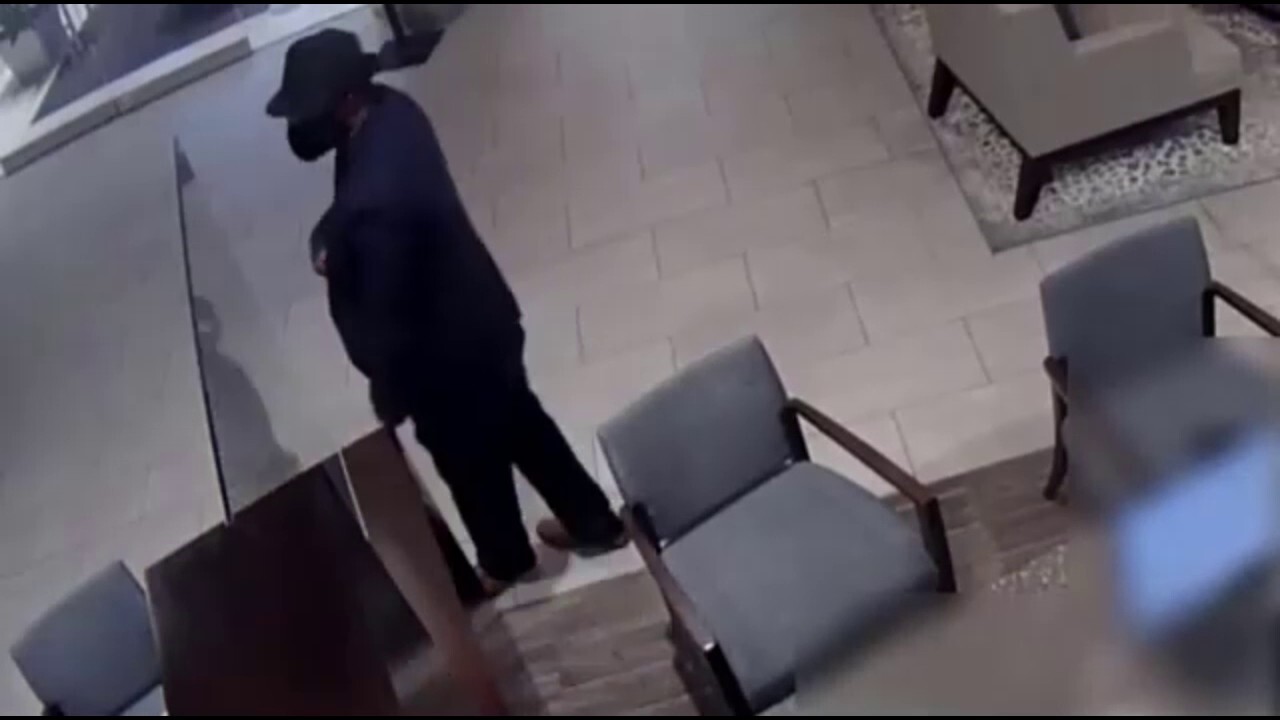 Houston man police say 'sharp dressed man' caught on camera robbing bank