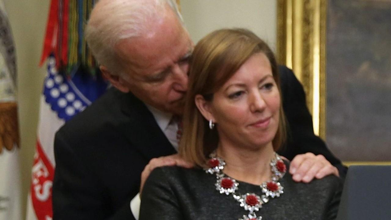 Wife of former Defense secretary calls photo with Biden misleading