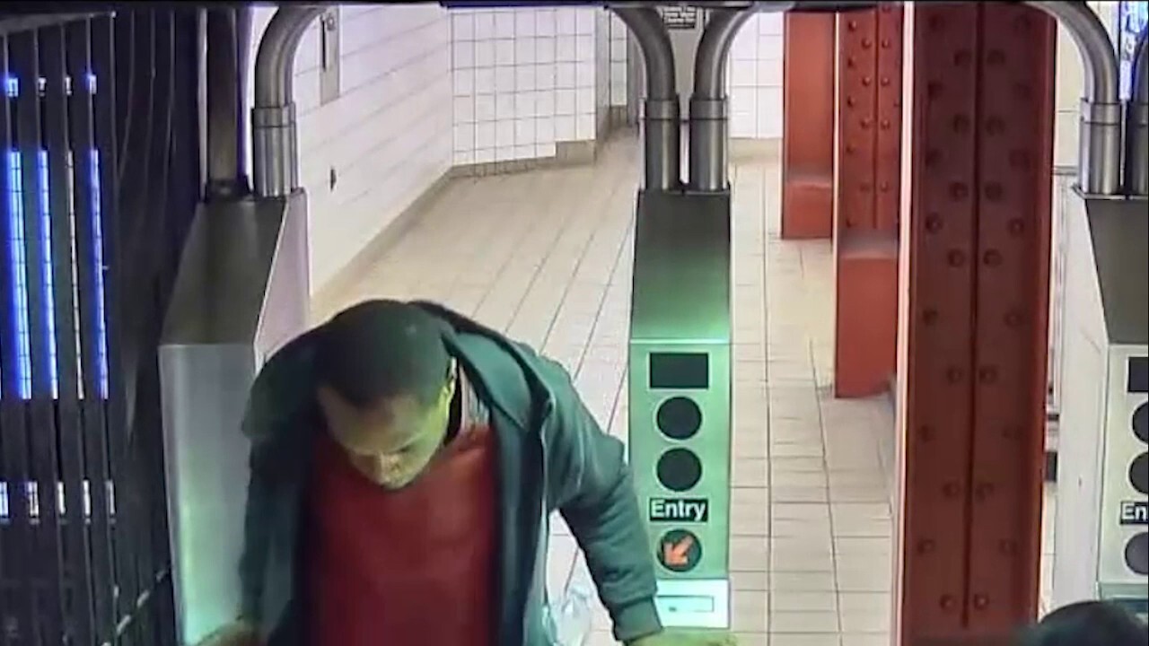 NYC subway shoving suspect pictured leaving through turnstile