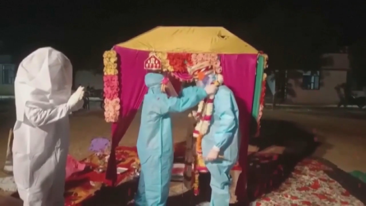 Indian couple weds in PPE after bride tests positive for COVID-19 before wedding