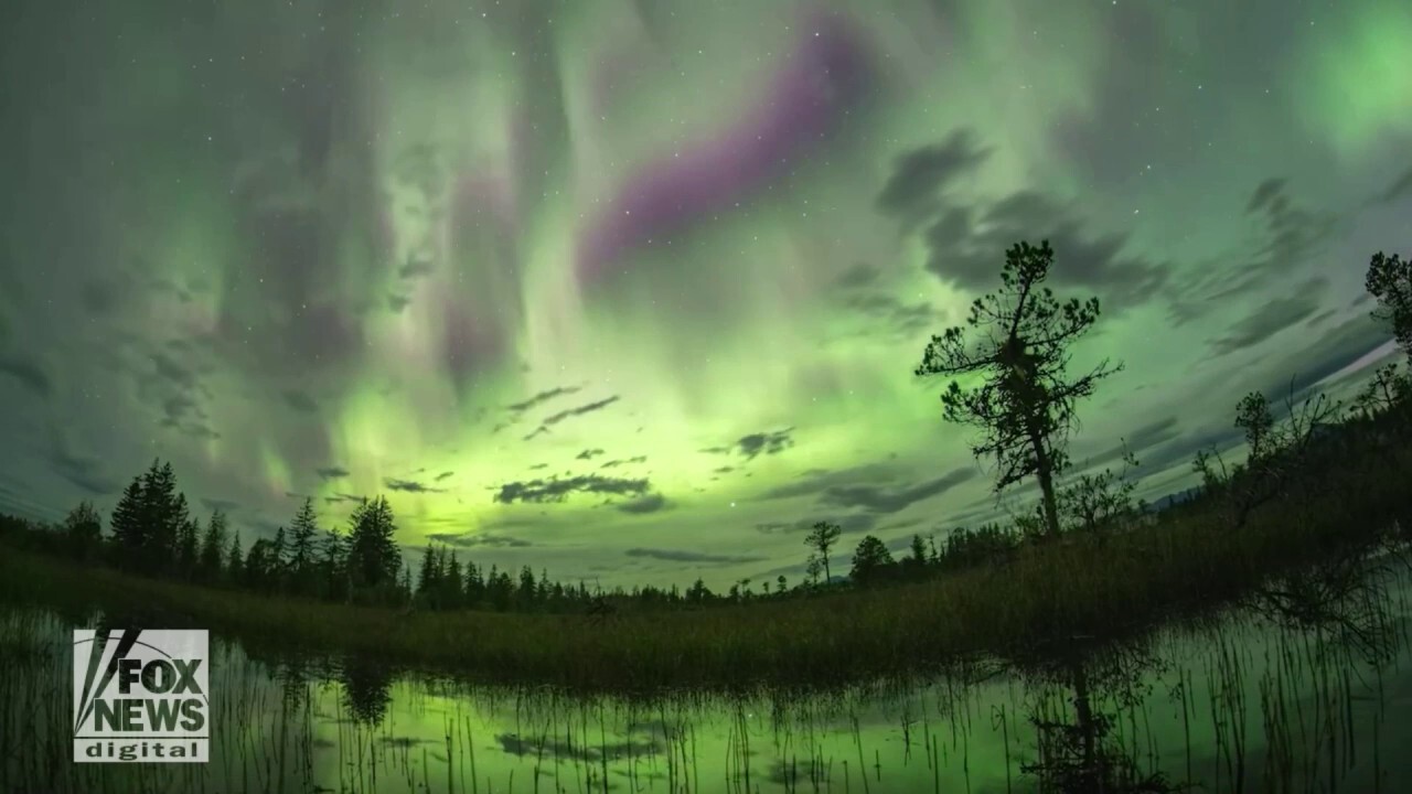 Northern Lights cast a green glow above Alaska’s Glacier Bay National Park