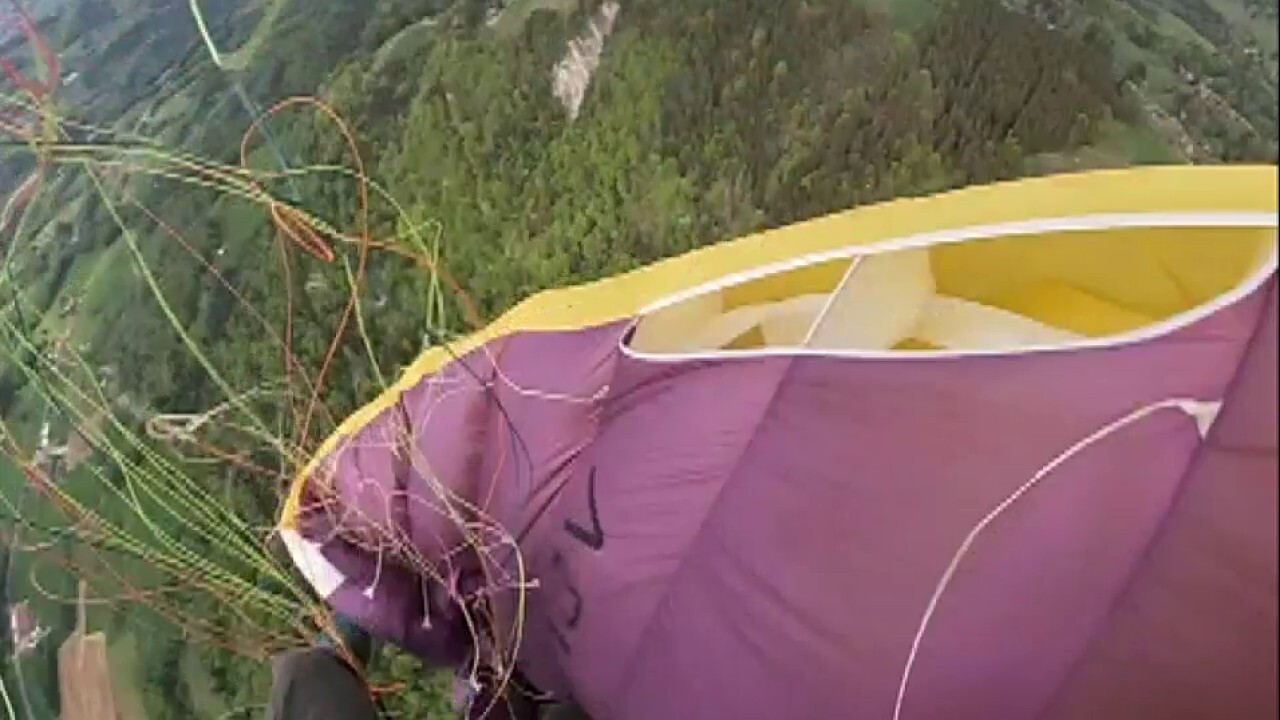 Raw video: Paraglider gets caught in own parachute, tumbles to the ground