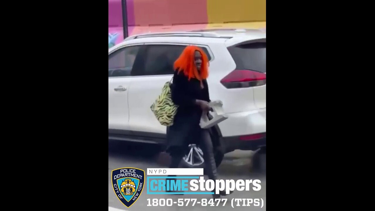 Thief in orange wig hurls cinder block into taxi window