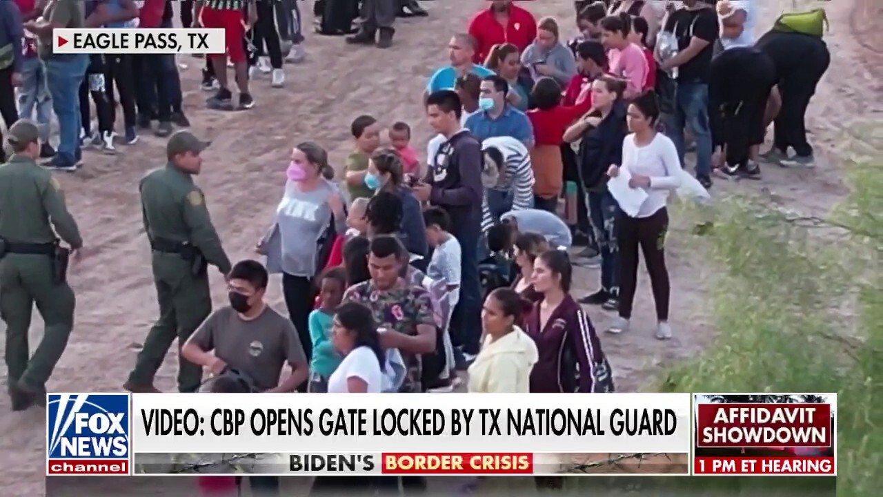 Video shows border agents opening locked gates to migrants