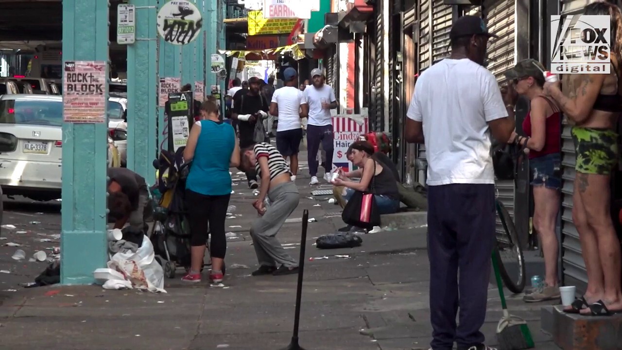 In Kensington's open-air drug market, some businesses struggle to entice prospective customers as drug users loiter or pass out on their front stoops.