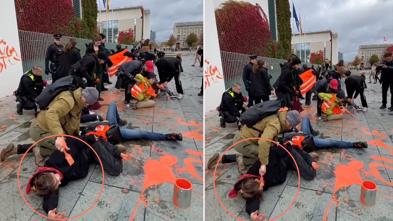German police officer accused of painting climate protester's face orange