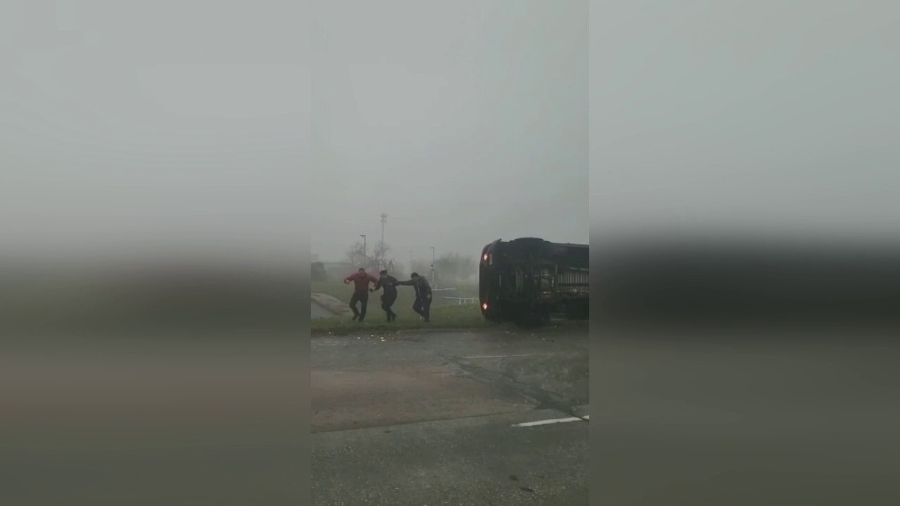 Pasadena, Texas man rescues UPS driver after truck turns onto side during storm