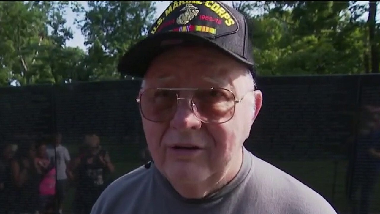 Marine veteran diagnosed with dementia visits Vietnam memorial with family