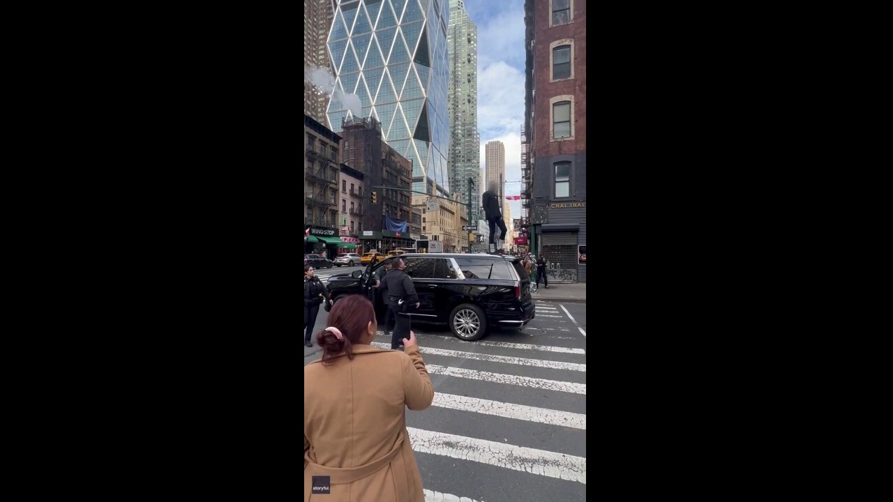 NYC carjacking suspect seen atop SUV trying to evade capture