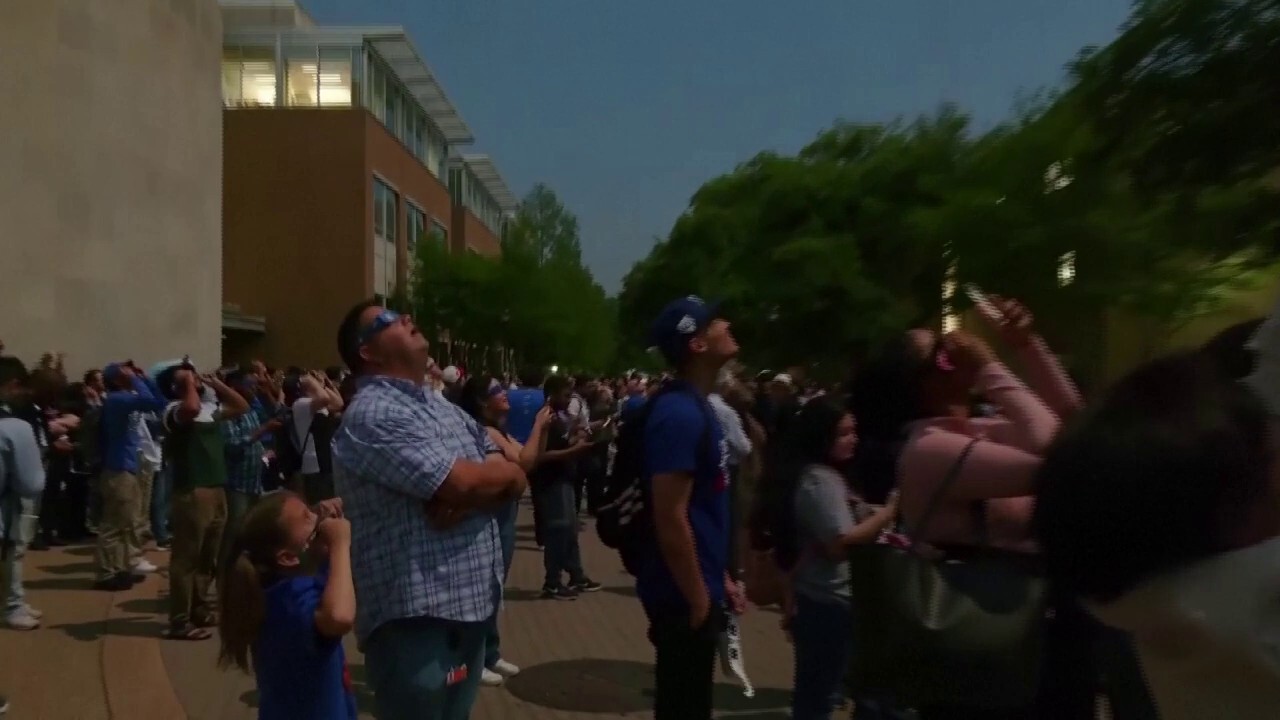 Crowd in awe as total solar eclipse crosses Arlington, Texas
