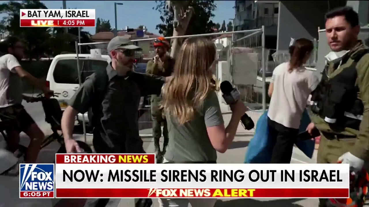Israelis scramble to safety as sirens go off amid conflict with Iran