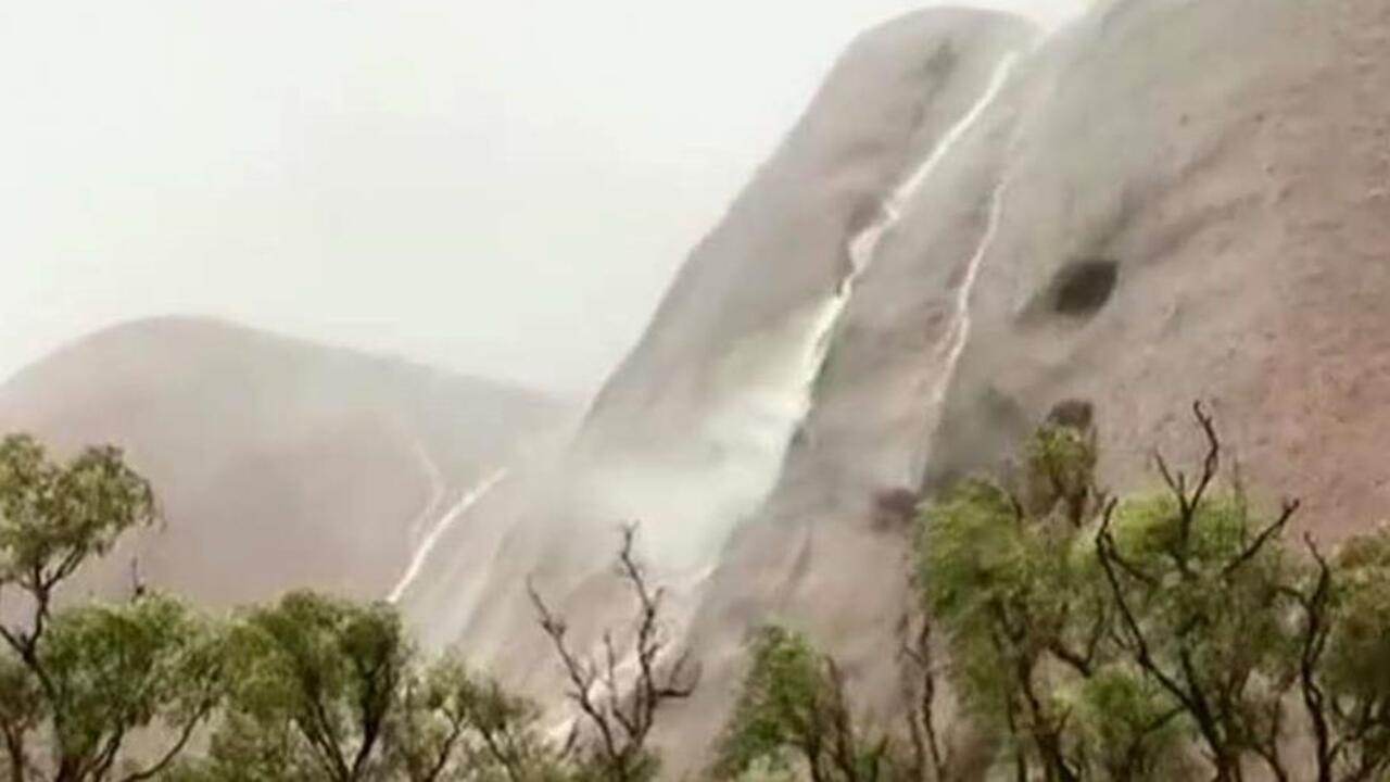 Flashfloods create waterfalls in Australia's iconic park