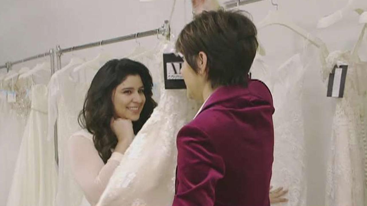Bridal designer giving wedding gowns to military brides