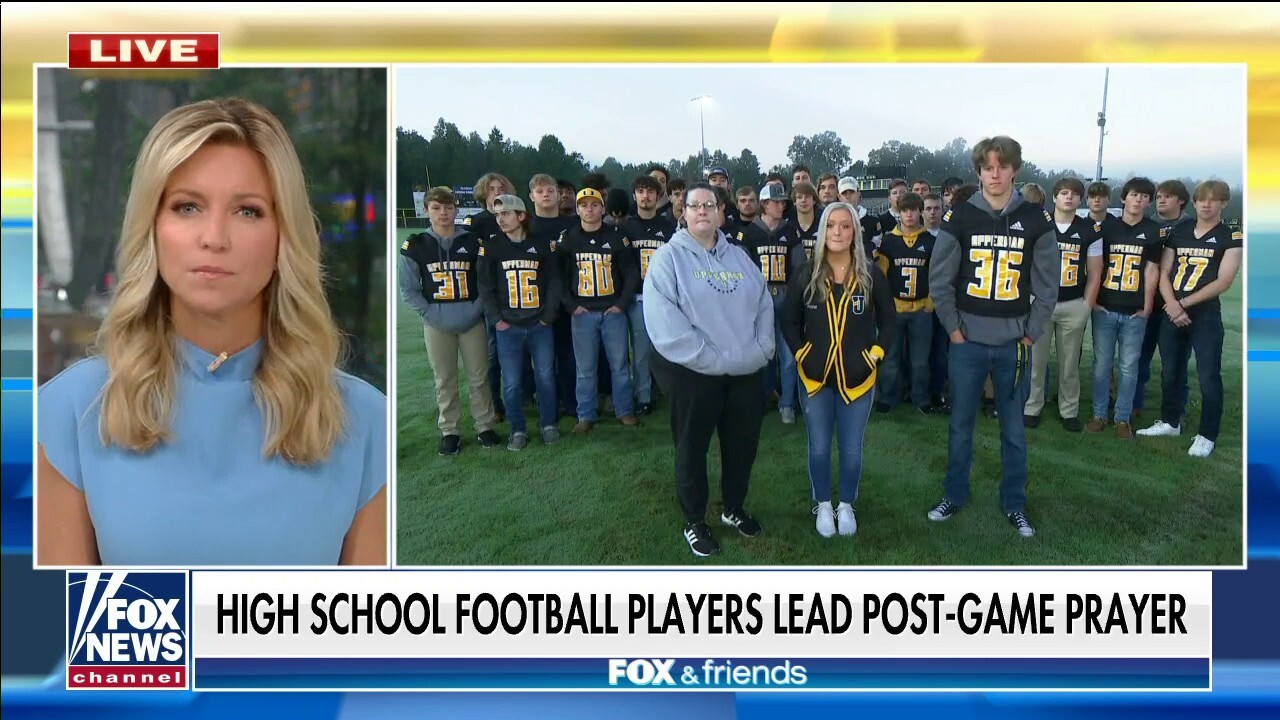 High school football player leads team in prayer after district prohibited coaches