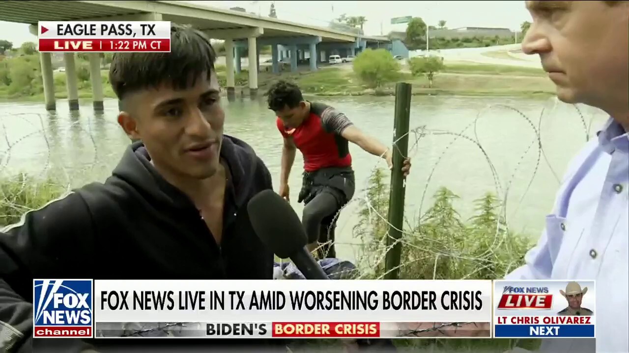 Griff Jenkins speaks to migrants as they cross the southern border