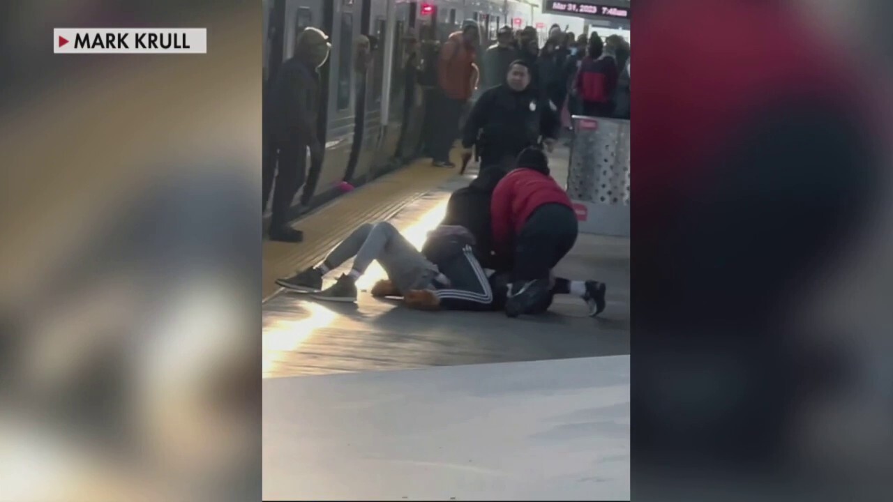 Philadelphia train passengers hold down alleged gunman before police arrive: video