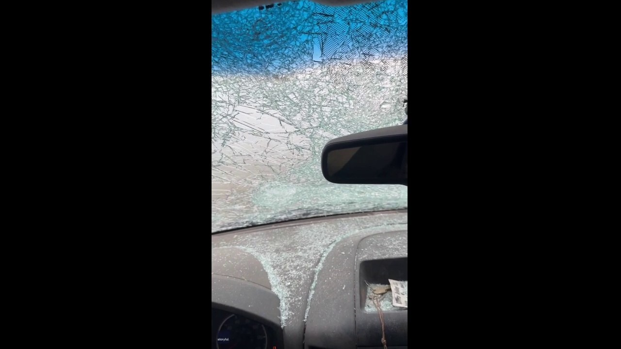 Huge chunks of hail hit windshield during severe storm