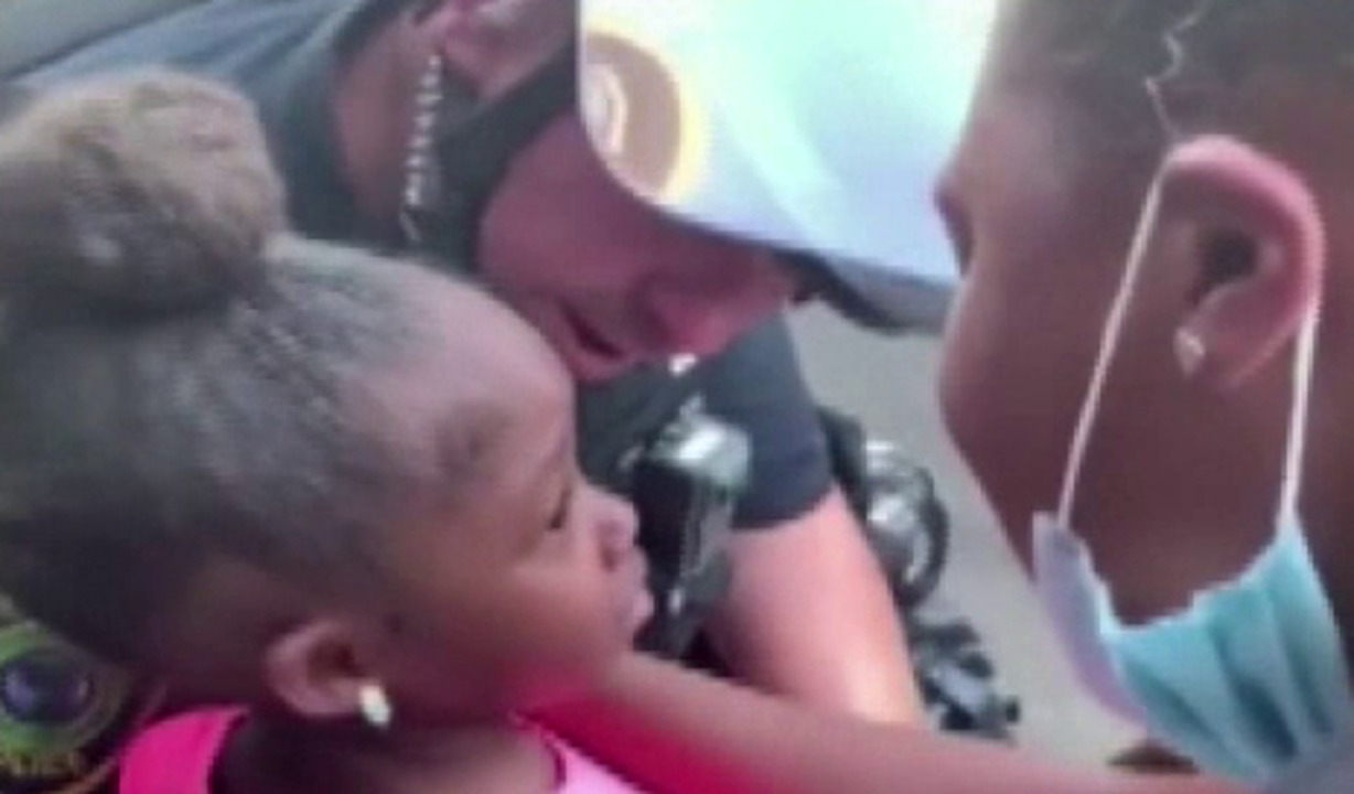 Texas police officer comforts crying girl during anti-racism protest: I'm here to protect you