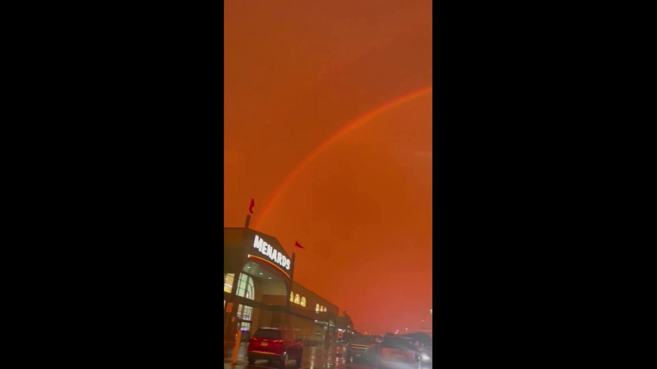 Red sky filled with rainbow draws eyes upward in Minnesota