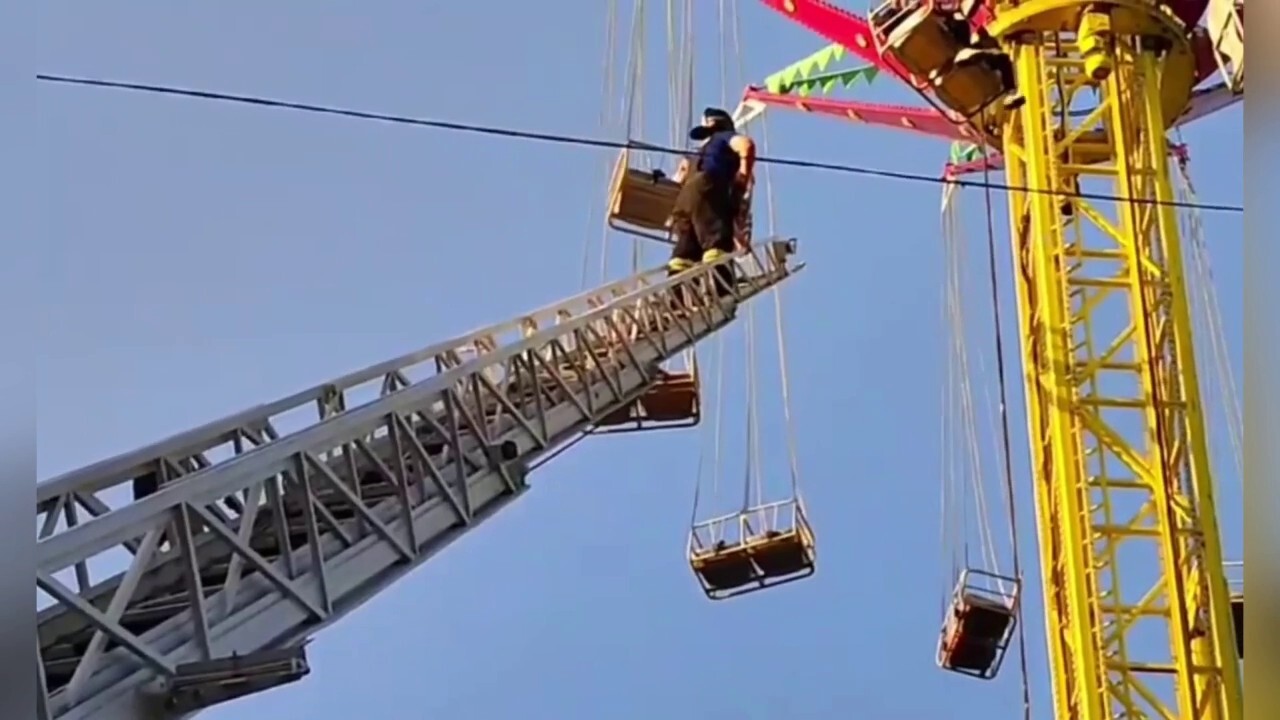 Emergency personnel rescue 13 people stranded on amusement park ride