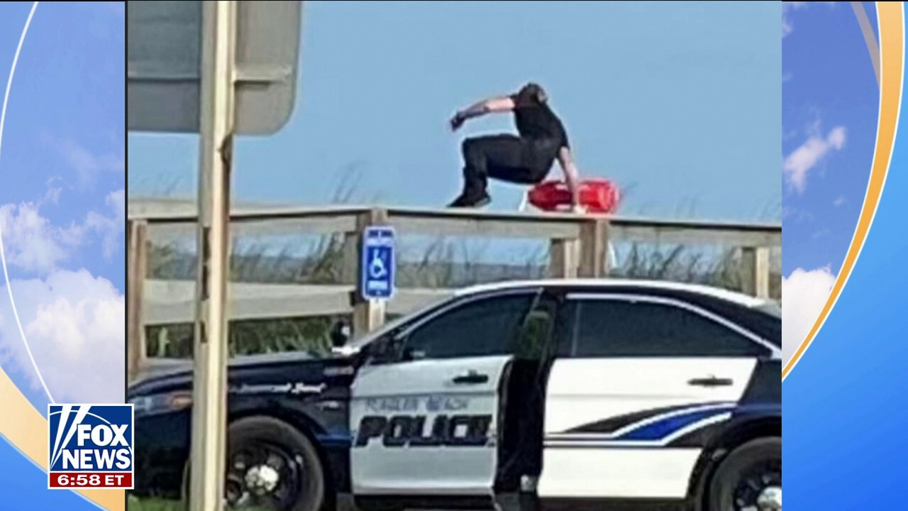 Florida police officer jumps out of squad car to rescue swimmers