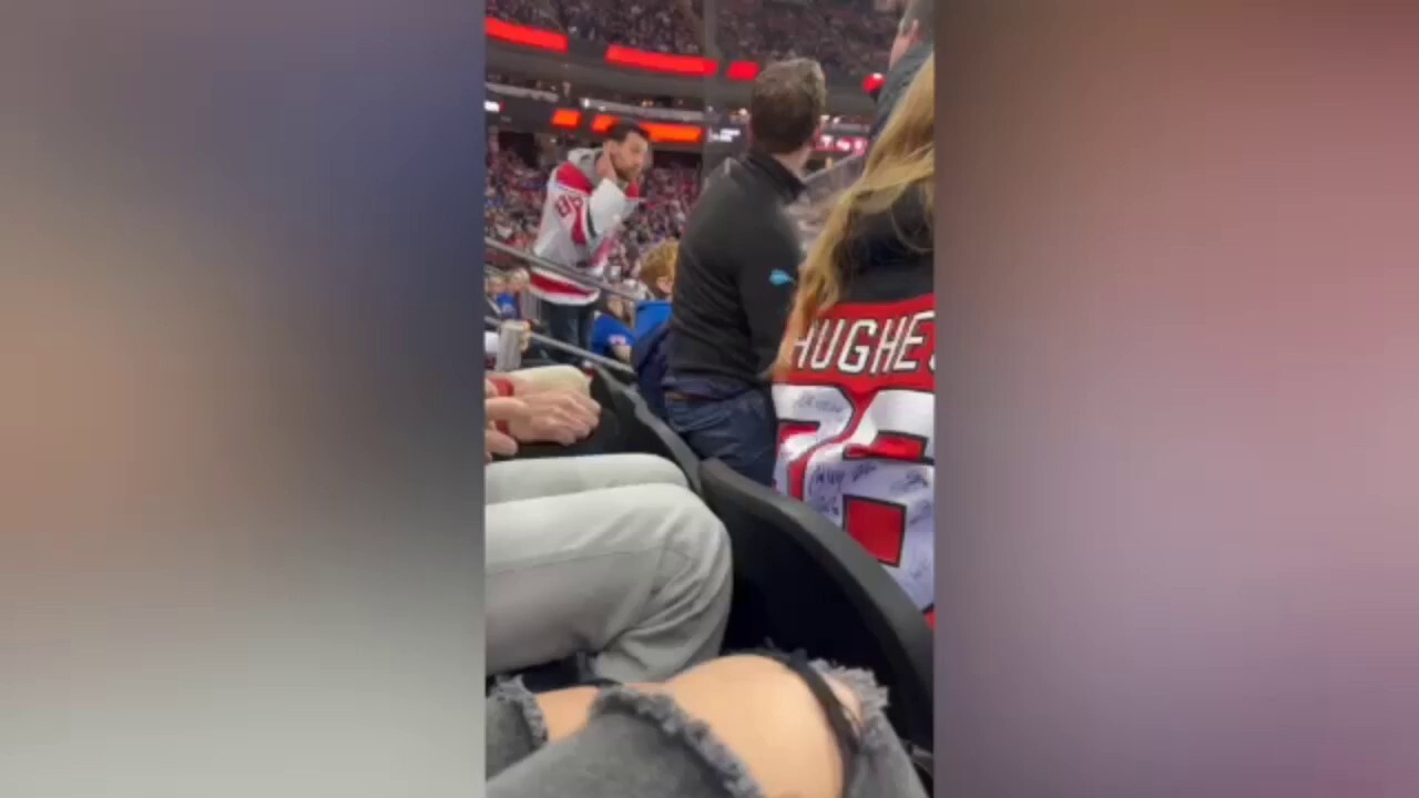 New Jersey Devils fan headbutts New York Rangers fan