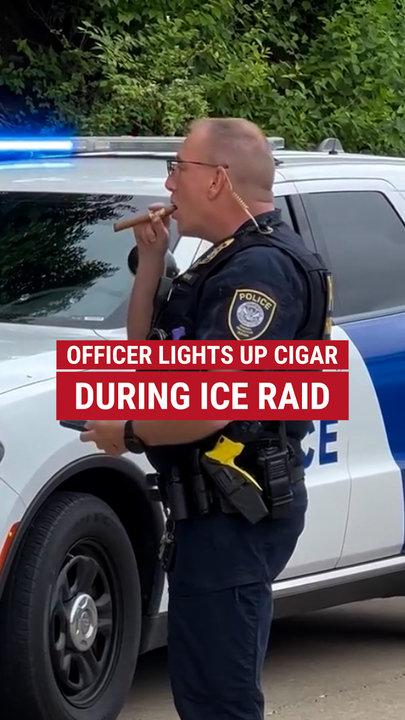 A DHS serviceman  was spotted smoking a cigar during an ICE raid