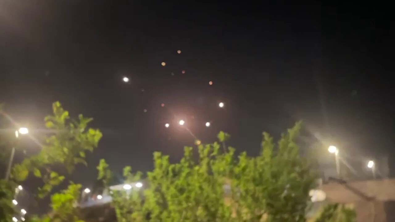 Israeli air defenses intercepting Iranian missiles