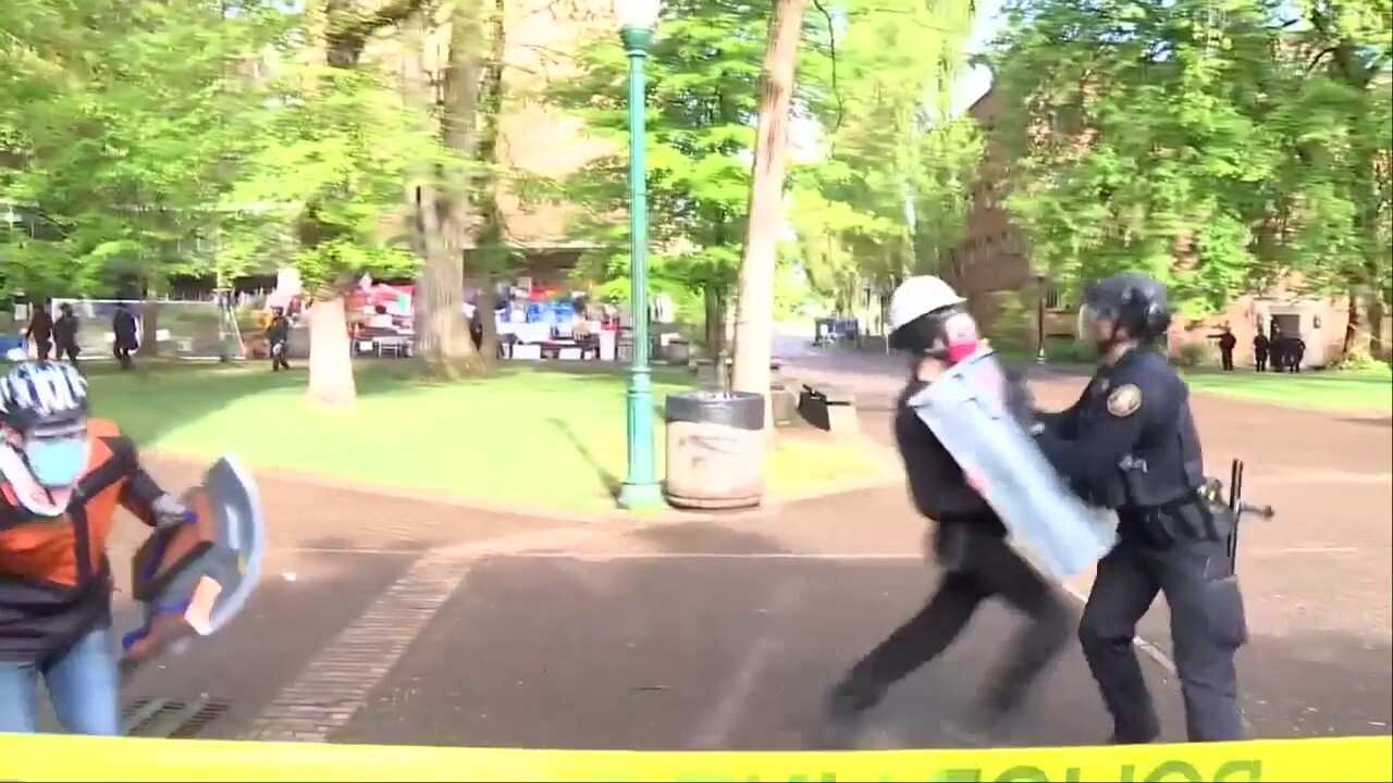 Portland State University anti-Israel protester charges at officer, gets knocked over